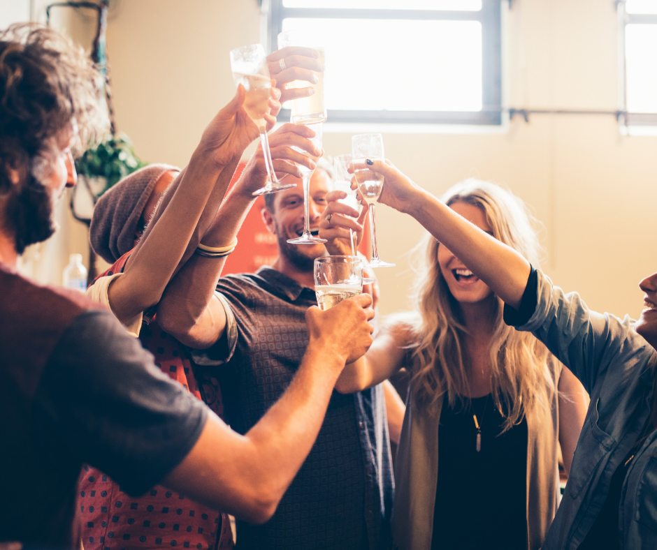 A group of friends toasting and spending time together - the perfect way to raise your vibe