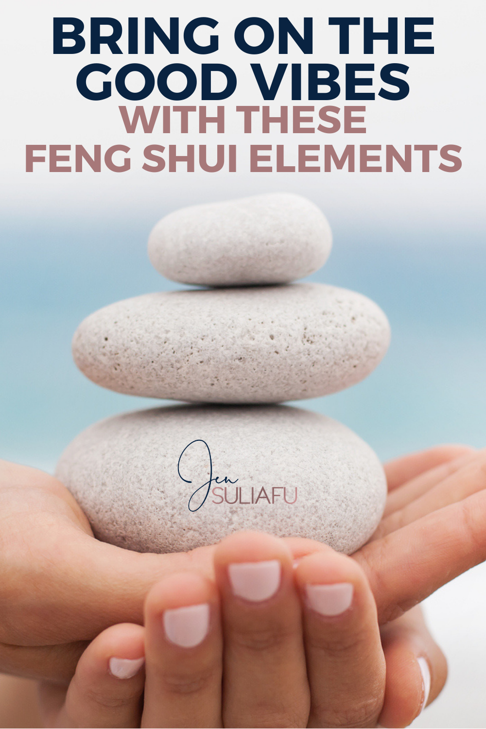 Photo of woman holding smooth stacking stones one of many Feng Shui Elements  